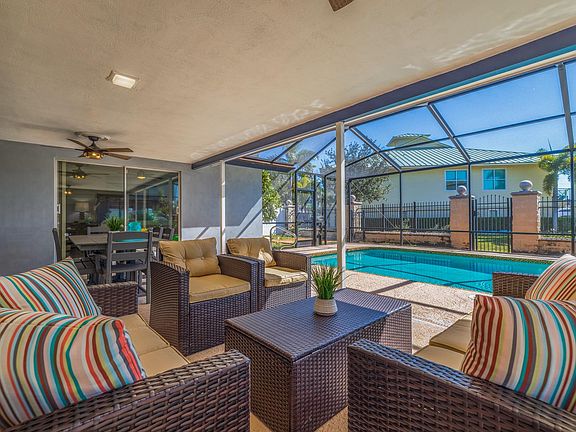 Screened Lanai patio with heated pool and water views!