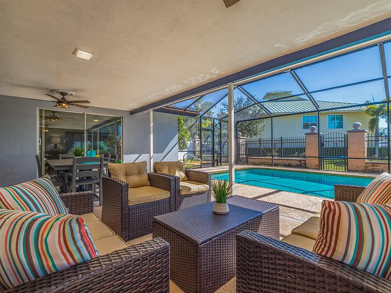 Screened Lanai patio with heated pool and water views!