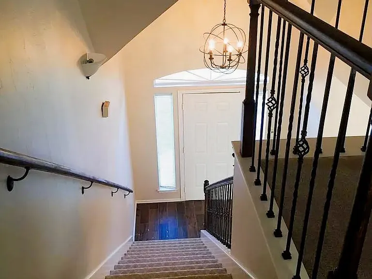 Stairs looking down to front entry way.