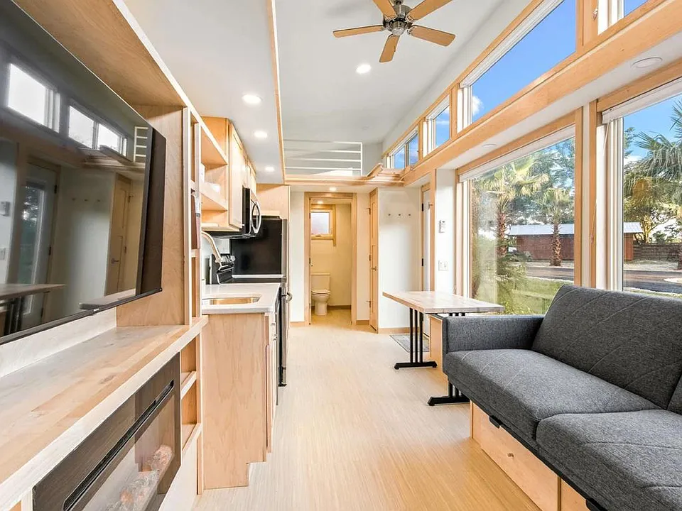 Living Area with foldable couch, fireplace and TV included.