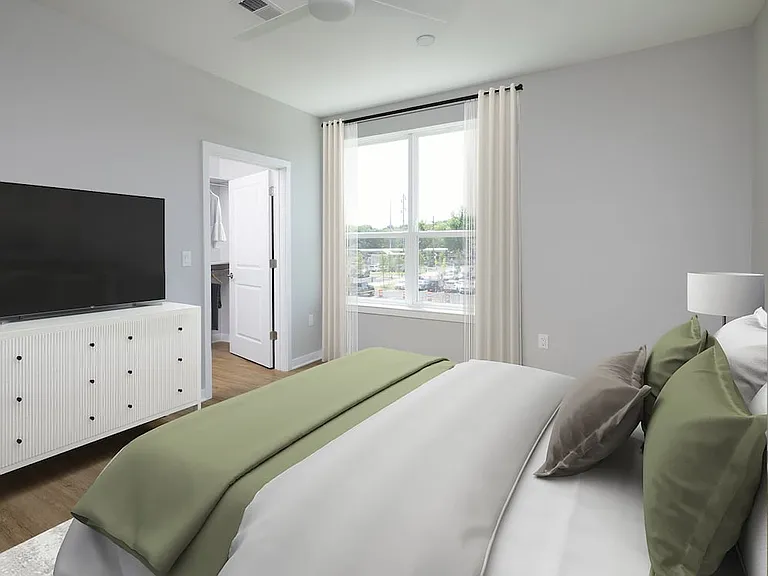 Signature Collection Primary bedroom with hard-surface vinyl plank flooring