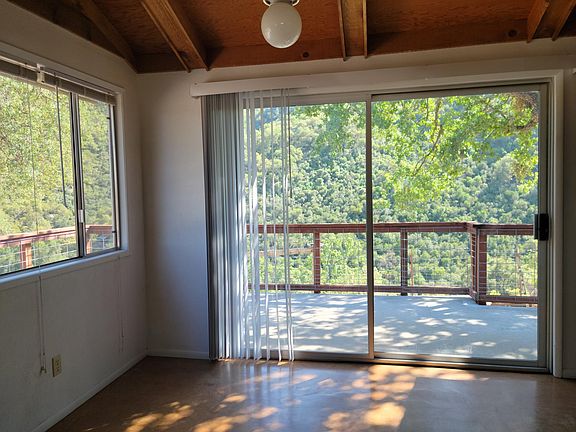 View of wrap around concrete porch from dining room