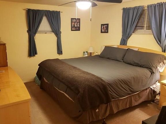 Two upper windows for easy placement of master bedroom furniture.  This is a KING-sized bed, still with plenty of space for nigh
