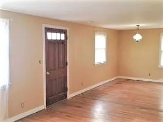 Front entry, as shown unfurnished, genuine hardwood floors, sunny rooms, next photos show rooms with previous tenant's furnishings