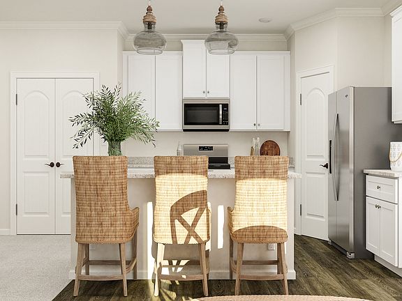 Kitchen includes stainless steel kitchen appliances