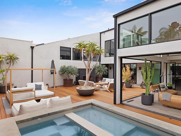 Another view of the gorgeous pool and convenient outdoor seating area.