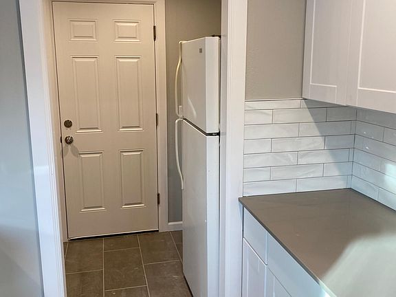 Utility room with washer dryer hookups