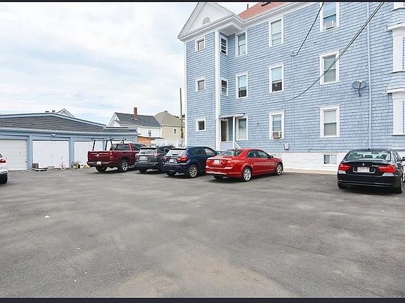 This parking lot is shared between the 3 units!