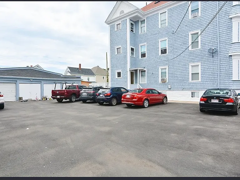 This parking lot is shared between the 3 units!