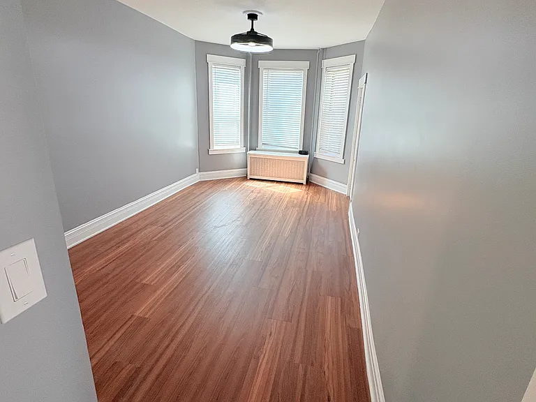 living room and dining room area empty; a blank canvas to style it and call it home
