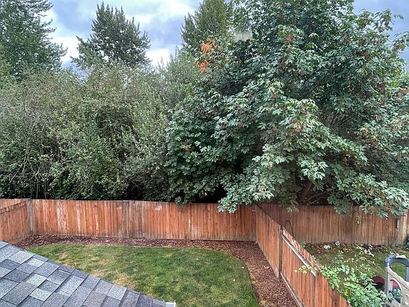 View of part of backyard and greenbelt