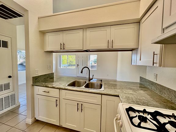 Kitchen with Granite Countertops and Modern Cabinets
