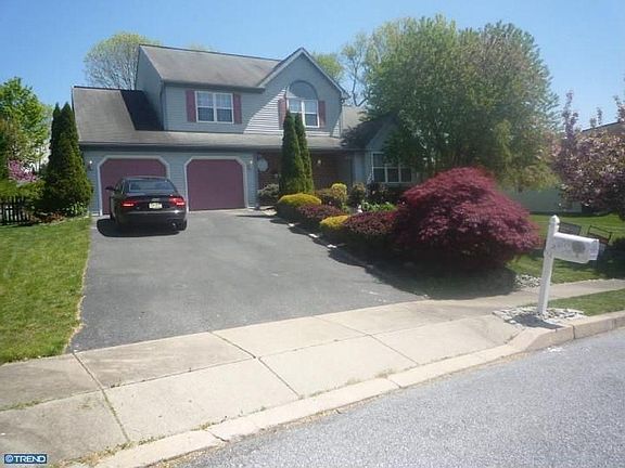 2-Car Garage with additional parking in driveway.