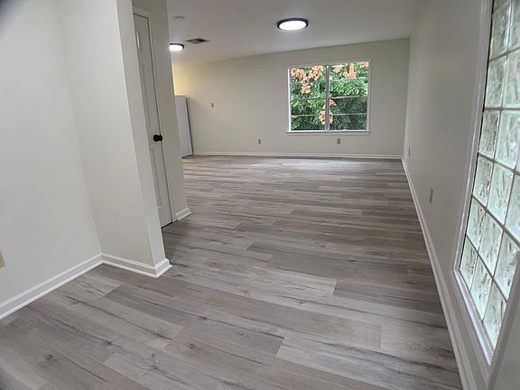 The large entry opens into a light filled living area