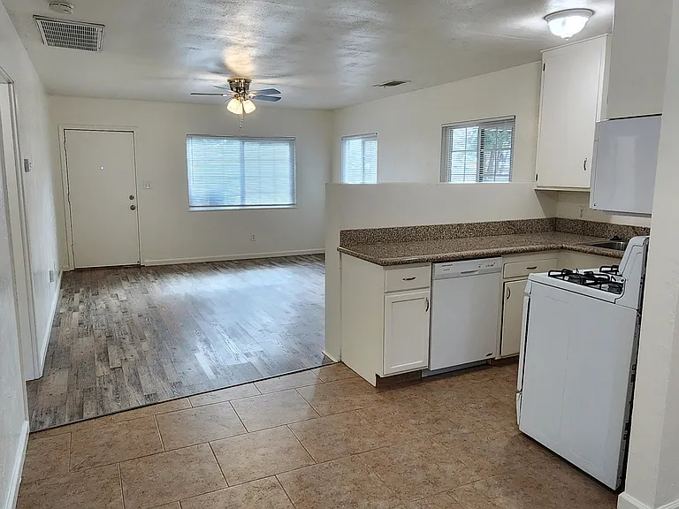 View of dining room, kitchen, and living room