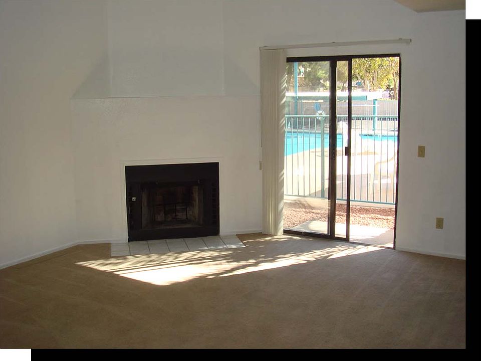 Fireplace and view of pool