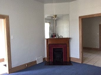 living room with old carpet