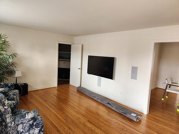 Large screen TV with 7 speaker surround sound system.