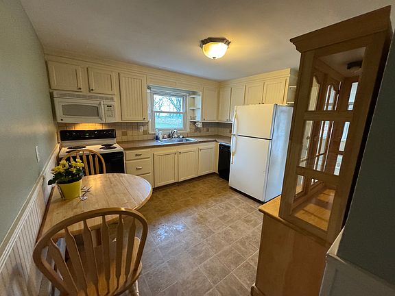 Eat in kitchen- stove, microwave, refrigerator and dishwasher.
