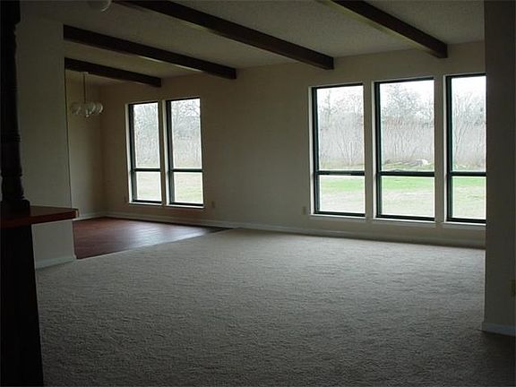 Den located off breakfast area and sun room.