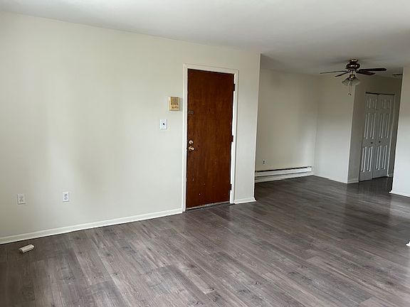 Living room and dining room and door to front foyer