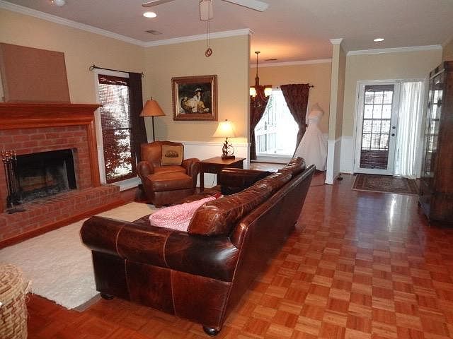 This photo was taken from the front foyer. It is the living room and you can see the bonus room (office, exercise, dining) overlooking the deck in the back.