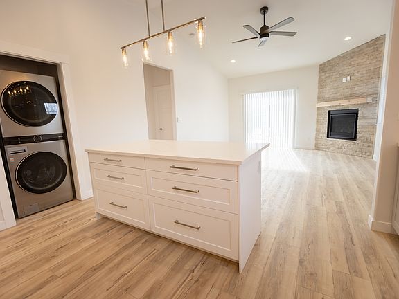 Kitchen Island, Laundry room with pocket door on left
