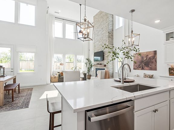 Spacious kitchen island overlooking dining area great room