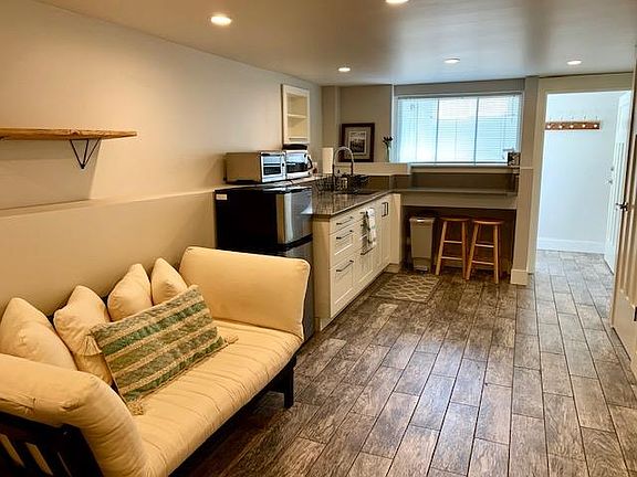 Futon converts into a small bed for short term guests.