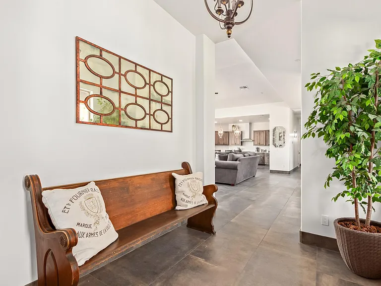 INSIDE FRONT ENTRANCE SHOWS GREAT ROOM STRAIGHT AHEAD.