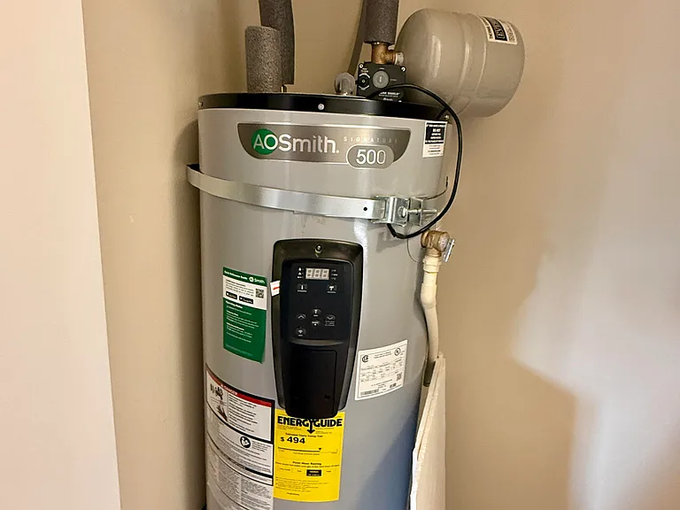 Laundry center also has hot water tank in it
