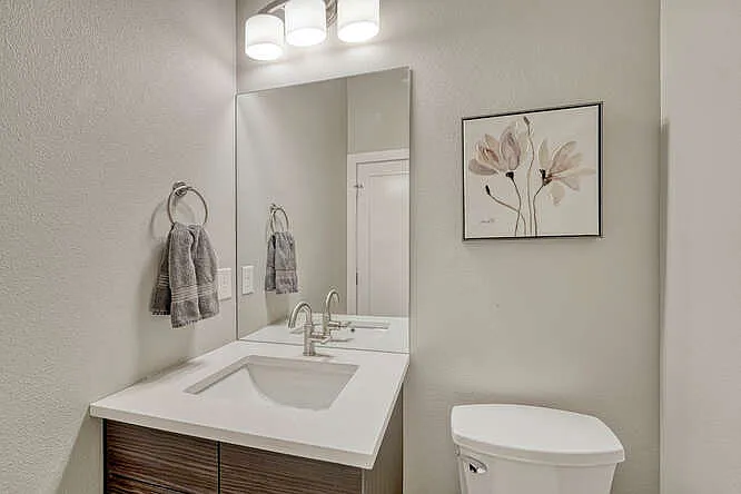 Half-bathroom off of the kitchen, main level