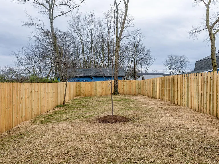 Large fenced back yard. Grass and landscaping have come in since this picture was taken.