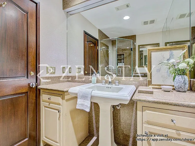 Bright bathroom with a sleek shower stall and clean finishes