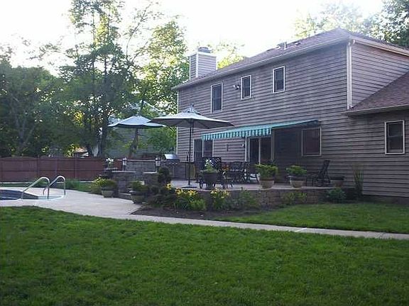 Totally landscaped yard with in ground pool.