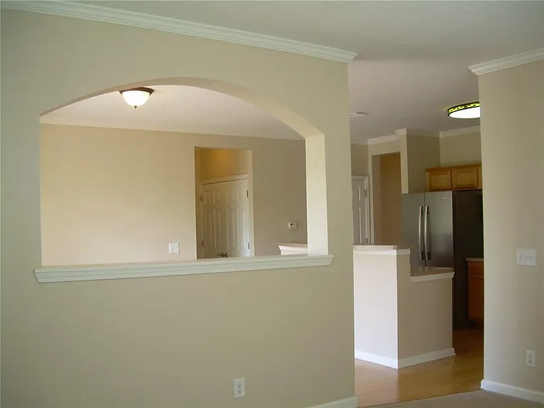 1975 Nocturne Drive
View from living room to dining area/kitchen and entry to Master Bedroom.