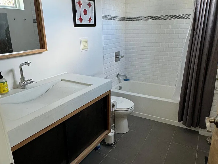 Bathroom 3 - full tub/shower, custom vanity.