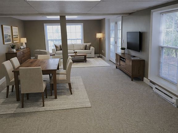 Spacious main living area _ part of 1,650 sq ft private apartment. Virtually staged to show potential layout and use.