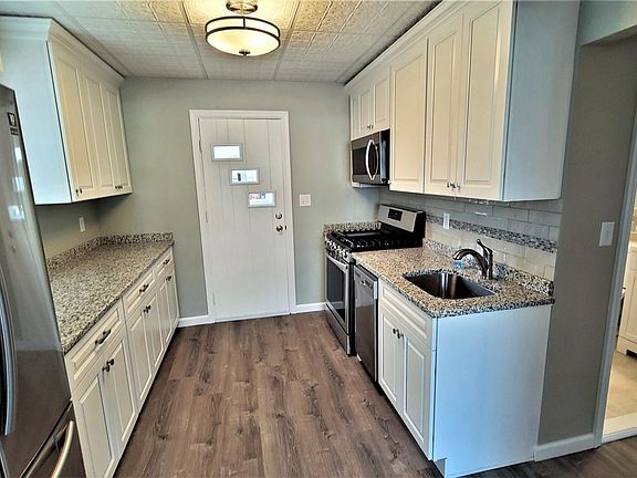 Kitchen. Backdoor to patio and yard