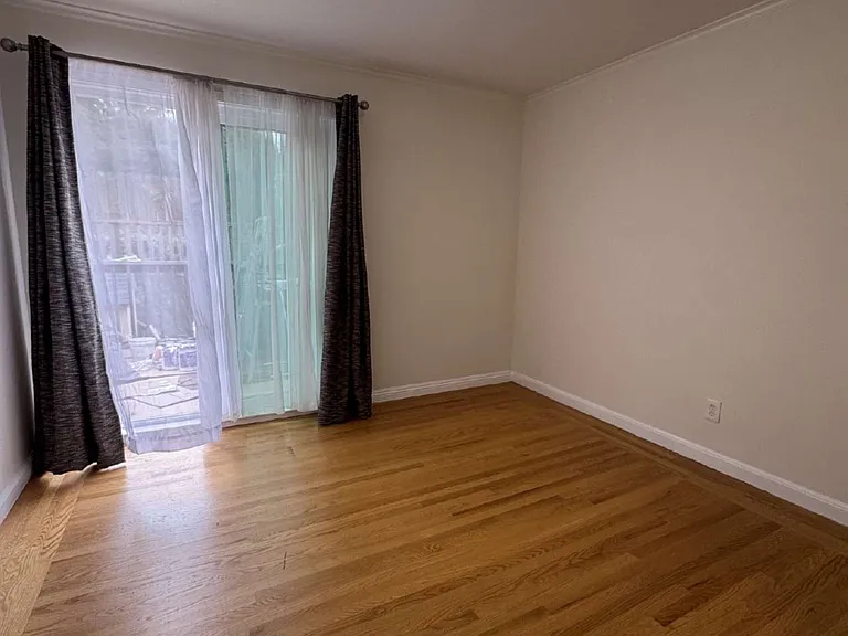 Bedroom #1 with bathroom and sliding door to the wood deck and stairs lead to the backyard. Monthly rent $1600, Security deposit $1600 plus cleaning fee.