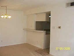 Spacious one bedroom, one and a half bath. Living room view into kitchen.