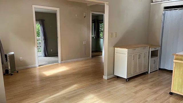looking from kitchen to 2 bedrooms and living room