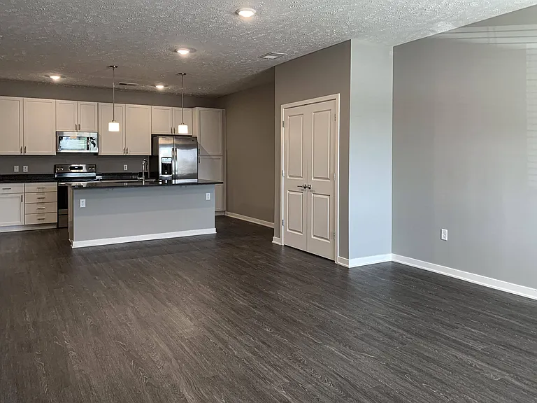 Open-concept layouts connect the kitchen and living areas, providing a seamless space to relax or gather.
