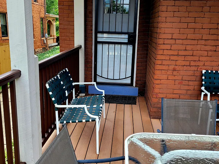 Back door entrance from deck. Porch furniture included.