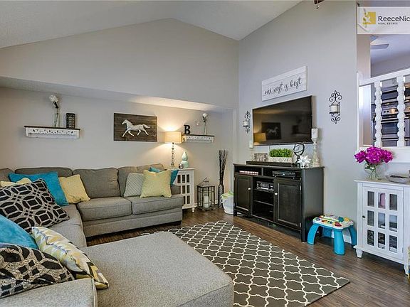 Another view of great room with vaulted ceiling.