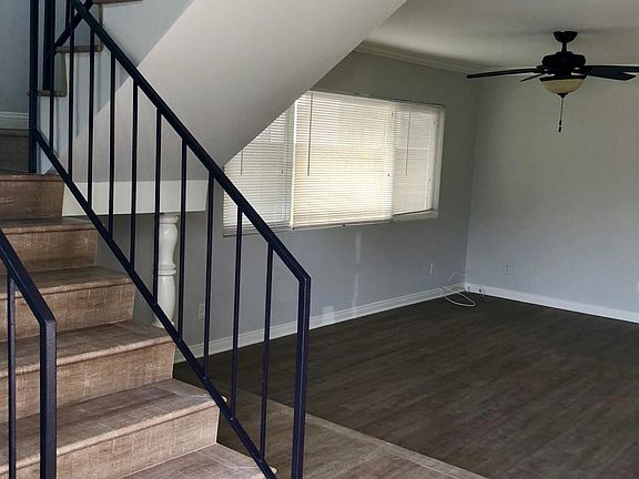 As you enter, the living room and second story stairs are on