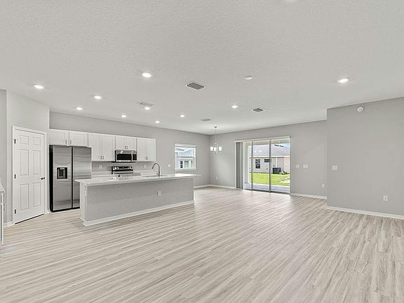 Enjoy a light-filled, open-concept living area - Aubrey II by Highland Homes