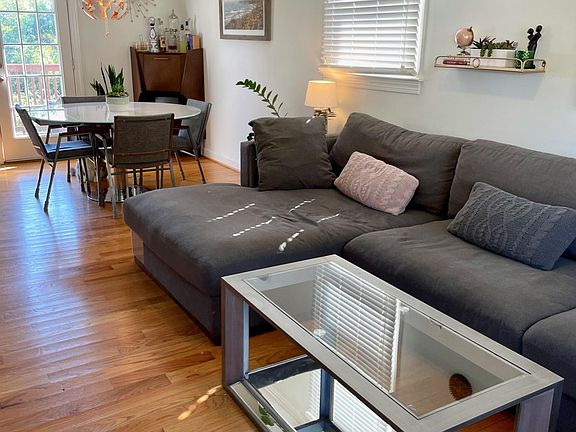 Main living area upstairs. Photo shows prior furnishings.