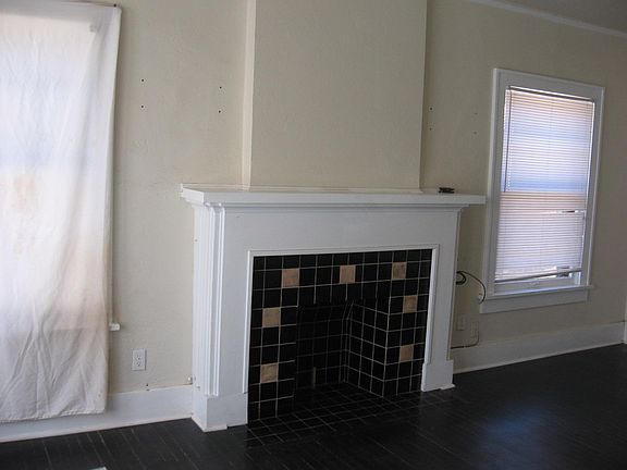 Mock Fireplace in large living room.