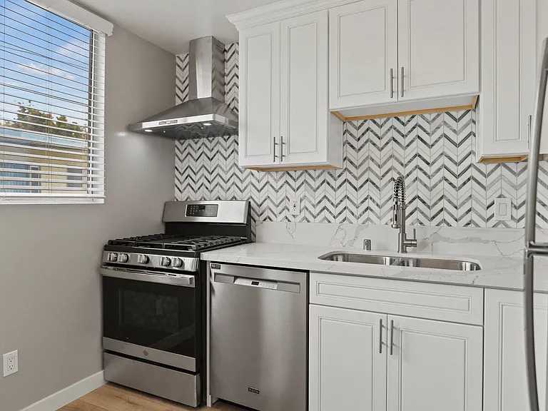 Kitchen with Stainless-Steel Refrigerator, Stove, and Dishwasher